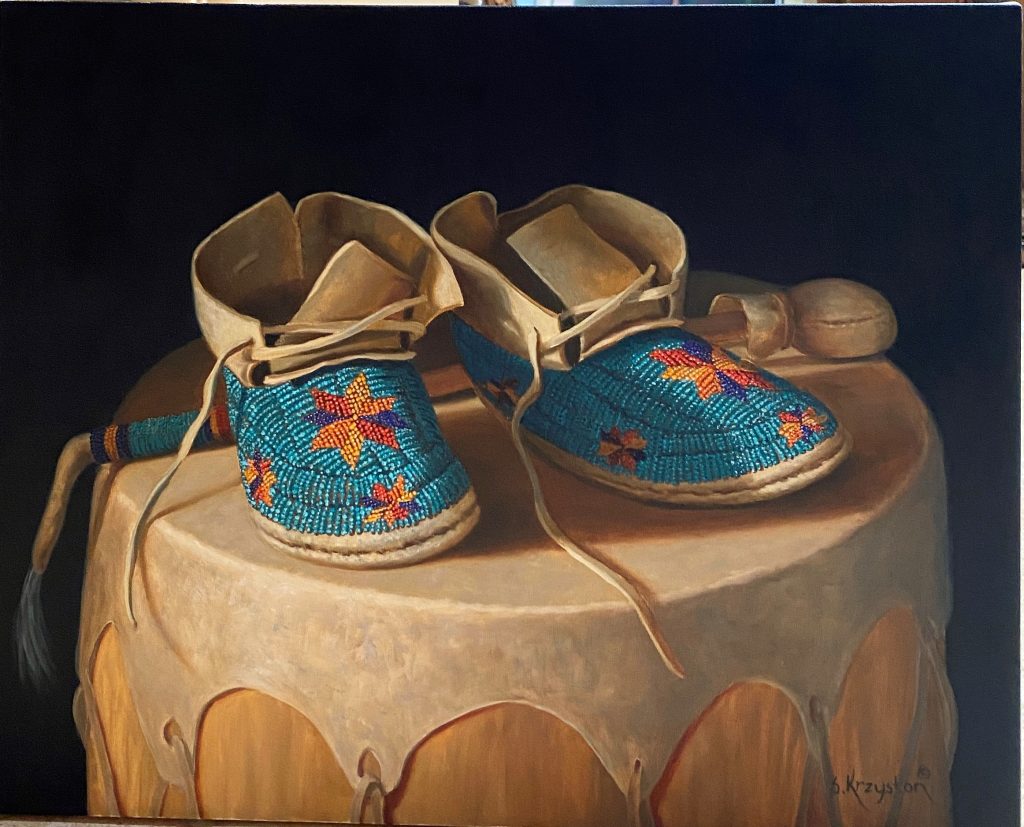 native american moccasin and pottery